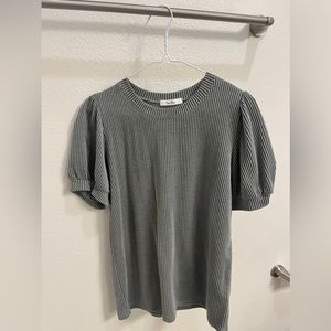 darker green blouse with puffy sleeves